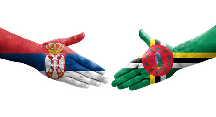 Handshake between Dominica and Serbia flags painted on hands, isolated transparent image.