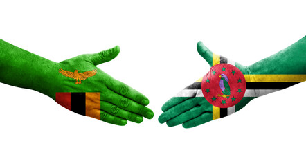 Handshake between Dominica and Zambia flags painted on hands, isolated transparent image.