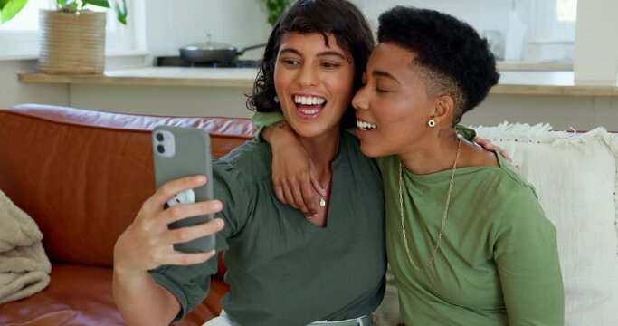 Phone, selfie and lesbian couple relax on a sofa, picture , bonding and having fun in a living room. Love, happy and women enjoying quality time together, photo and their relationship in their home