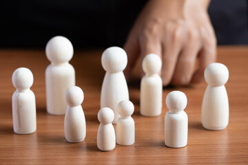 HR manager hand or Employer chooses takes in hand employee. Leader stands out from crowd. Looking for good worker.suitable for demanding tasks