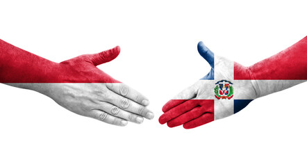 Handshake between Dominican Republic and Monaco flags painted on hands, isolated transparent image.