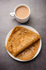 Chai Paratha - Hot Tea served with Flatbread is a traditional simple meal from India and Pakistan