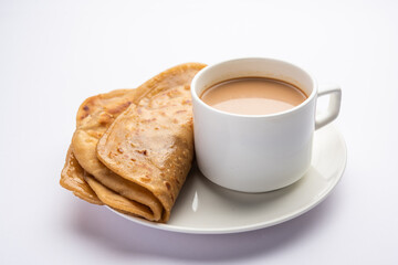 Chai Paratha - Hot Tea served with Flatbread is a traditional simple meal from India and Pakistan