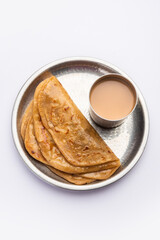 Chai Paratha - Hot Tea served with Flatbread is a traditional simple meal from India and Pakistan
