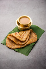 Chai Paratha - Hot Tea served with Flatbread is a traditional simple meal from India and Pakistan