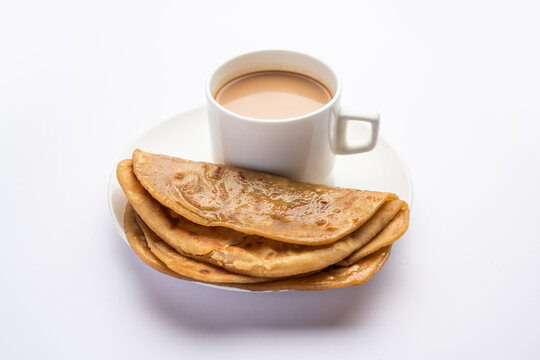Chai Paratha - Hot Tea served with Flatbread is a traditional simple meal from India and Pakistan