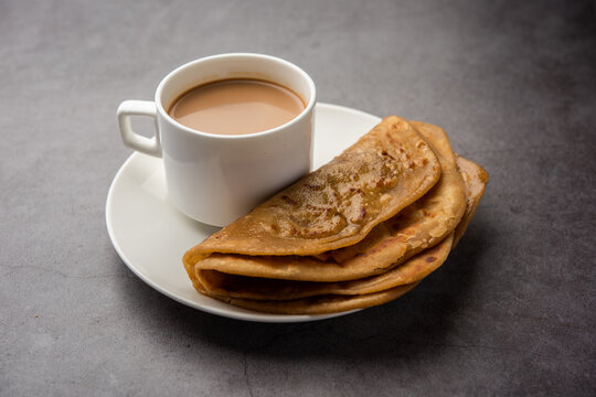 Chai Paratha - Hot Tea served with Flatbread is a traditional simple meal from India and Pakistan