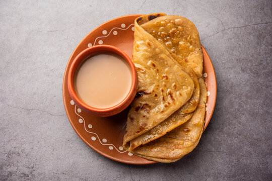 Chai Paratha - Hot Tea served with Flatbread is a traditional simple meal from India and Pakistan