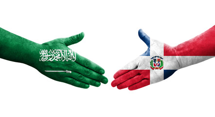 Handshake between Dominican Republic and Saudi Arabia flags painted on hands, isolated transparent image.