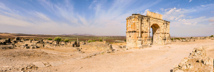 Panoramic view at the ruins of Caracalla arch in ancient town Volubilis - Morocco