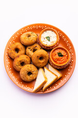 Instant leftover bread medu vada served with chutney and hot tea, Indian breakfast or snack recipe