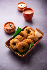 Instant leftover bread medu vada served with chutney and hot tea, Indian breakfast or snack recipe