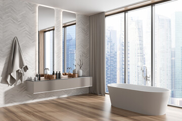 Cozy bathroom interior with double sink and bathtub, panoramic window