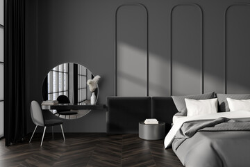 Dark bedroom interior with bed, bedsides, curtain, chair, round mirror