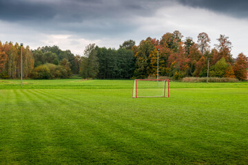 A football (soccer) training ground in a rural autumn landscape. Perfectly trimmed lush green grass. .A beautifully situated football field. Polanka Wielka, Poland © p  a  t  r  i  c  k