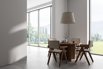 Light living room interior with eating table and chairs, panoramic window
