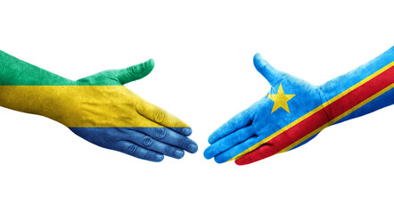 Handshake between Dr Congo and Gabon flags painted on hands, isolated transparent image.