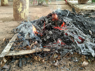 burning dry leaf waste..common in Indonesia but very disturbing to the community
