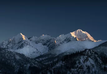 Foto op Plexiglas Himalaya Mountain peaks covered with snow. Mountains in winter