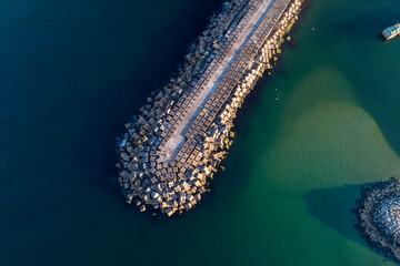 Obraz premium zenithal aerial drone view of a harbour barrier in northern portugal