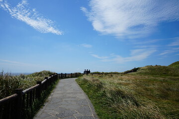Fototapeta premium fascinating seaside walkway with clouds