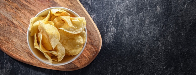 Composition with a bowl of potato chips