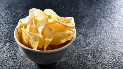Composition with a bowl of potato chips