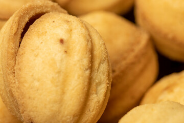 Homemade cookies in the shape of a nut with a sweet filling. Close-up, selective focus.