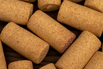 Wine corks scattered on a wooden background. Close-up, selective focus