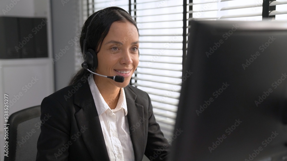 Aufkleber competent female operator working on computer and talking with clients. concept relevant to both cal