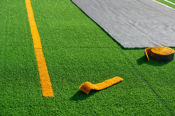 Laying of synthetic grass