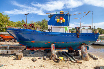 Fishing boats on stands waiting for maintenance