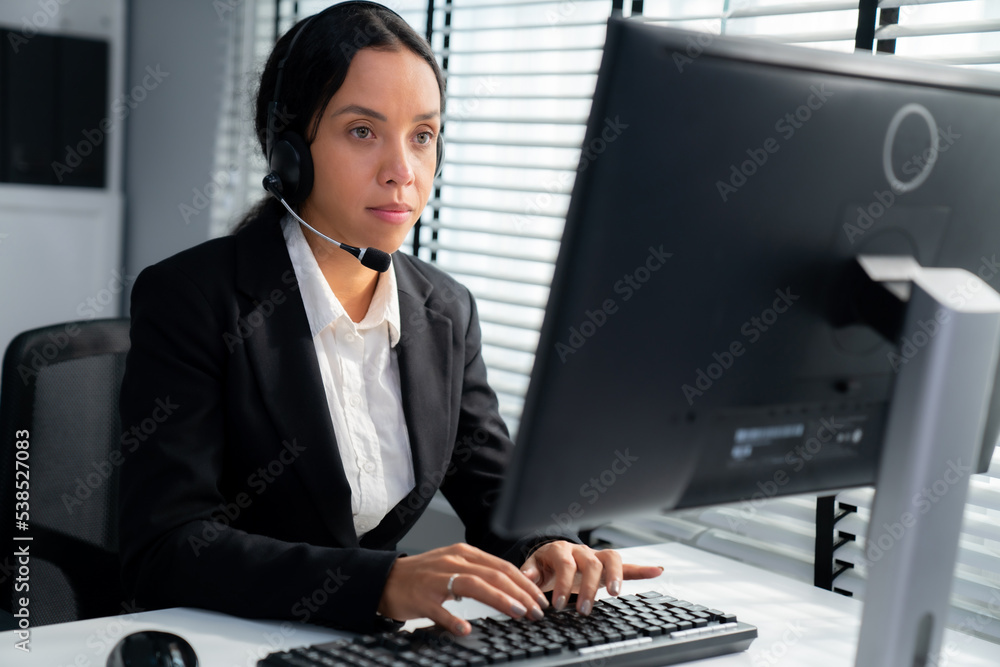 Aufkleber competent female operator working on computer and talking with clients. concept relevant to both cal