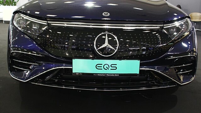 Detail of front mask of german battery powered electric full size luxury liftback car Mercedes EQS displayed on motoshow in Nitra, Slovakia. Deep blue metallic colour.  