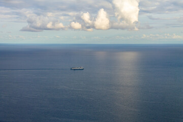 Cargo ship transporting containers in the ocean