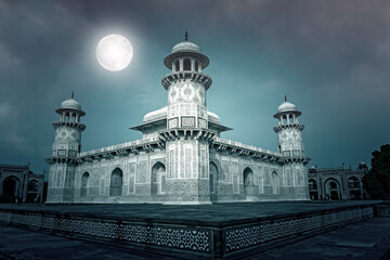 Amazing  marble Tomb of Itimad-ud-Daulah or Baby Taj Mahal in the night with moon in Agra, India. Collage