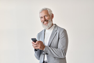 Happy old business man smiling senior mature older businessman professional wearing suit holding cell phone using smartphone mobile app online standing isolated on white background looking at camera.