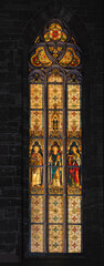 Fototapeta premium Exterior shots of a stained glass window of St Johannis Church in Goettingen