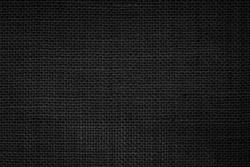 Black Hemp rope texture background. Haircloth wale black dark cloth rustic sackcloth canvas fabric texture.
