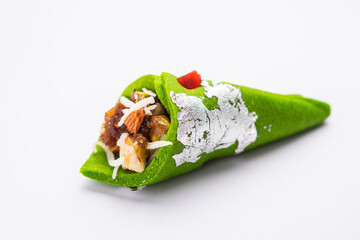Kaju Gulkand Paan Mithai barfi - Indian sweet or dessert served in a plate