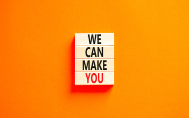 Support and we can make you symbol. Concept words We can make you on wooden blocks. Beautiful orange table orange background. Business, psychological we can make you concept. Copy space.