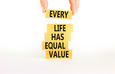 Every life has equal value symbol. Concept words Every life has equal value on wooden blocks. Businessman hand. Beautiful white background. Business and every life has equal value concept. Copy space