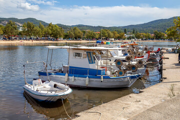 Fototapeta na wymiar Fishing boats at dock waiting fishermen