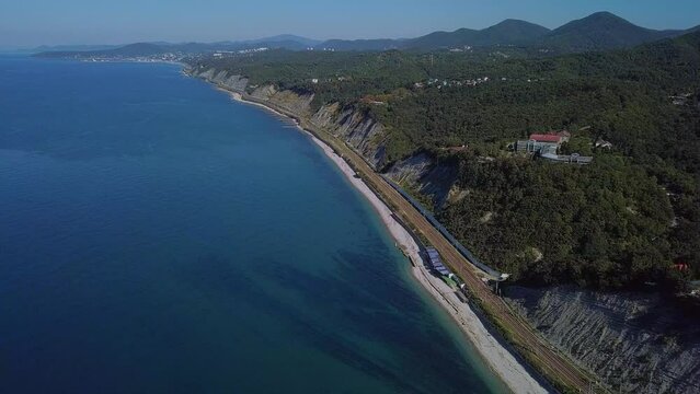 above the railway station in the resort village near the Black Sea -  panorama aerial view on a sunny summer day