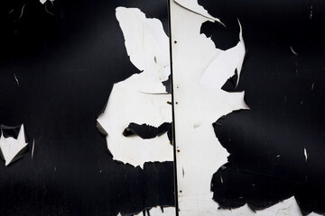 peeled painted black and white wall