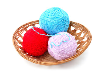 Knitted balls in a basket.