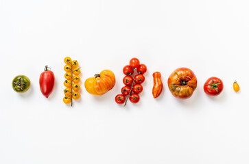 Different tomatoes on white background. Top view. High resolution product