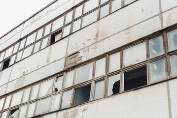 Building with broken windows. Abandoned factory. Abandoned building.