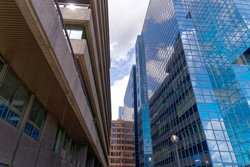 Cityscape with modern office buildings at City of London on a blue cloudy summer day. Photo taken August 1st, 2022, London, United Kingdom.