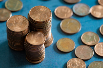 Stacks of euro cents coins on metal surface. Money saving concept